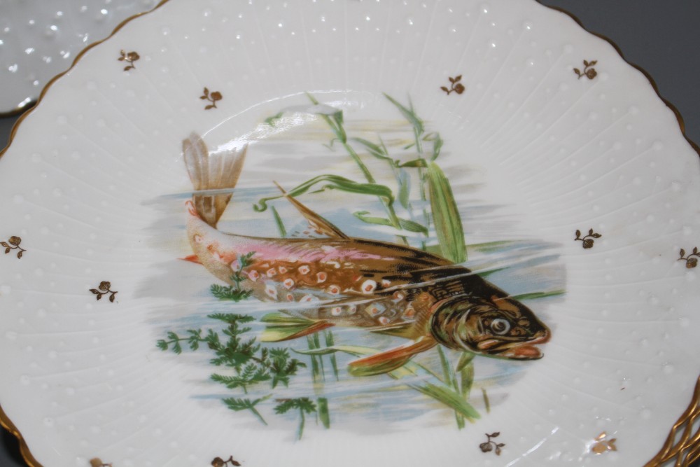 A Limoges thirteen piece porcelain fish service, printed with pike and other freshwater fish